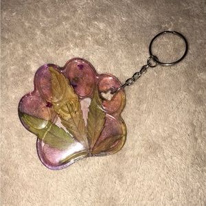 Custom epoxy resin paw keychain with my favorite leaf and red eyed zebra New
